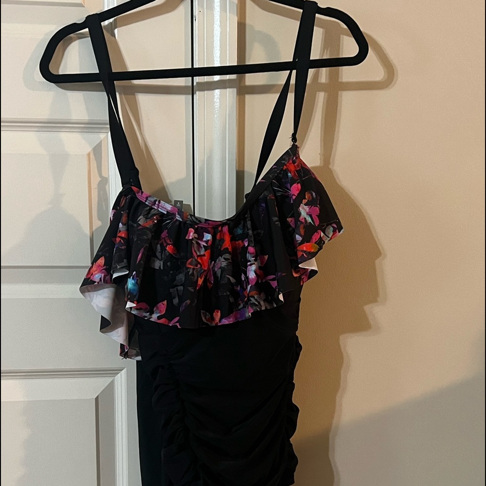 Brand new off shoulder one piece bathing suit with roughing detail from torrid.